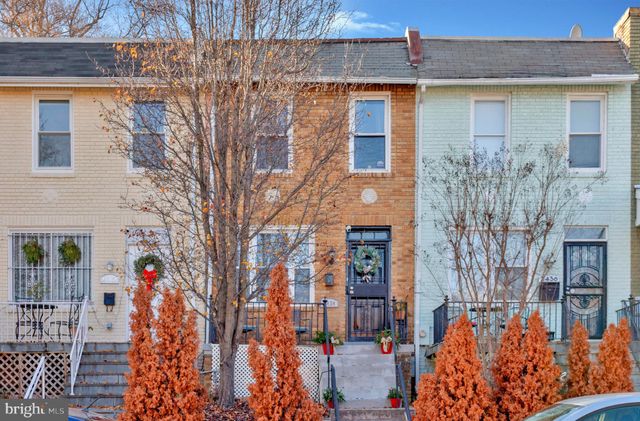view of a brick buildings with many windows
