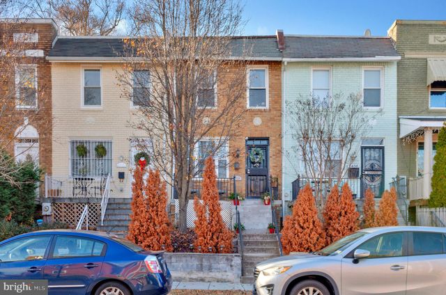 a front view of a building with parking space
