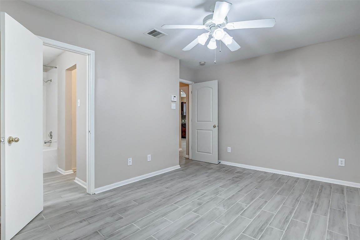 10822 Cane Grove Lane Houston, TX 77075 - Photo 14 of 44 a view of an empty room with wooden floor