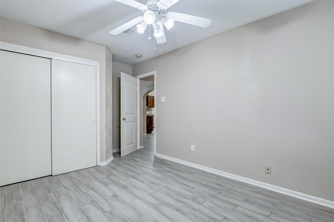 10822 Cane Grove Lane Houston, TX 77075 - Photo 25 of 44 a view of an empty room with wooden floor