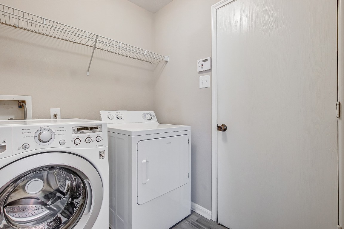 10822 Cane Grove Lane Houston, TX 77075 - Photo 29 of 44 a utility room with dryer and washer