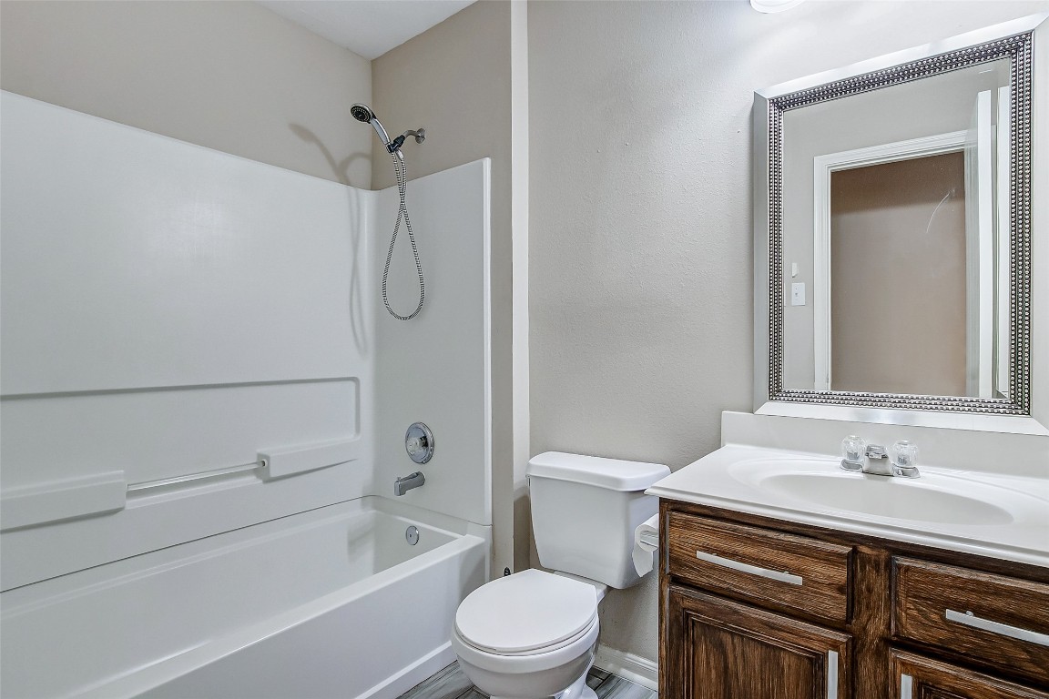 10822 Cane Grove Lane Houston, TX 77075 - Photo 32 of 44 a bathroom with a sink a toilet and shower