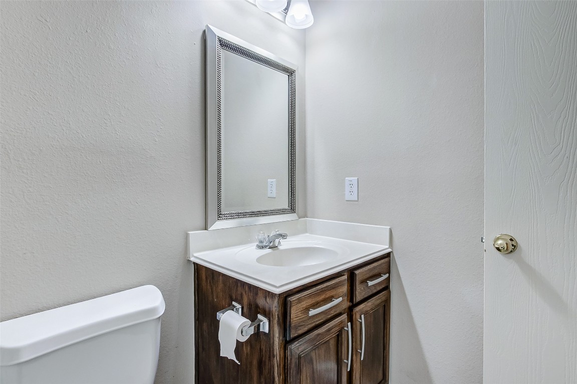 10822 Cane Grove Lane Houston, TX 77075 - Photo 33 of 44 a bathroom with a sink and a toilet