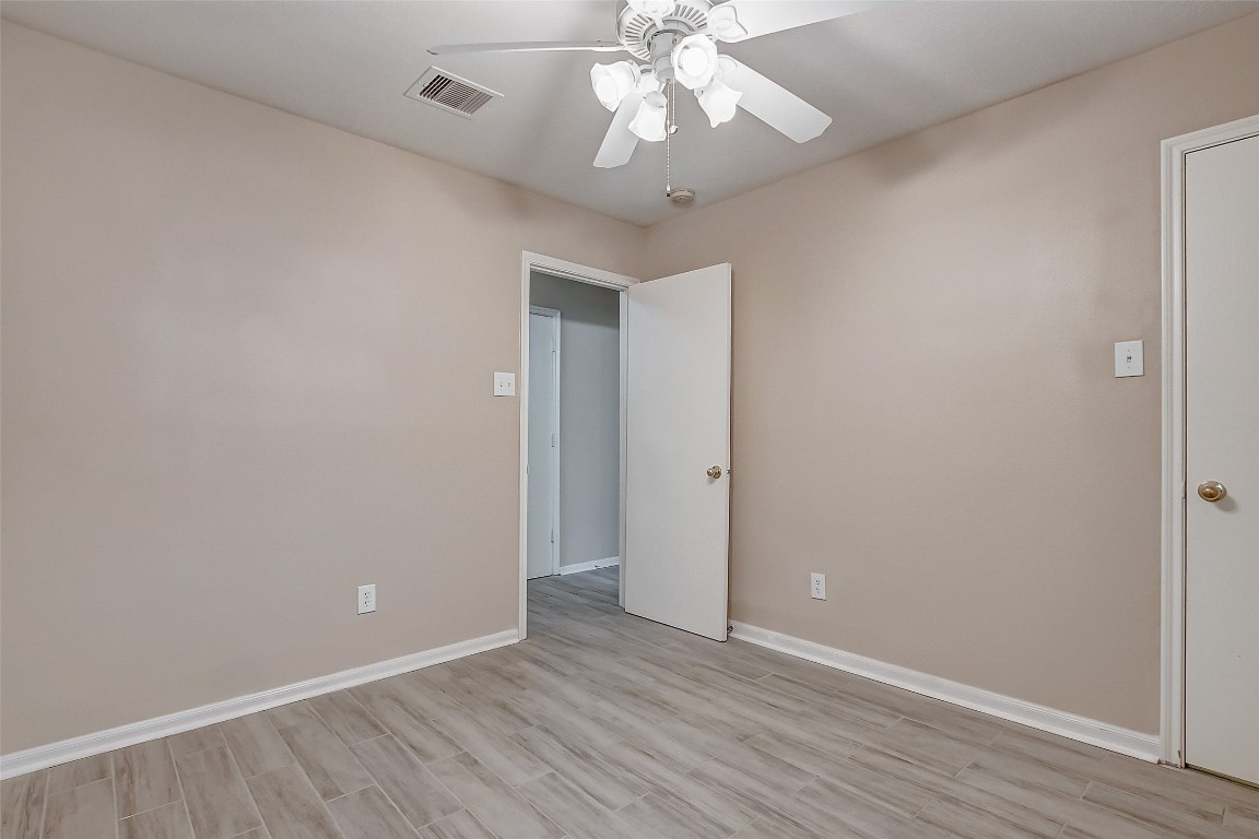 10822 Cane Grove Lane Houston, TX 77075 - Photo 34 of 44 a view of an empty room with wooden floor