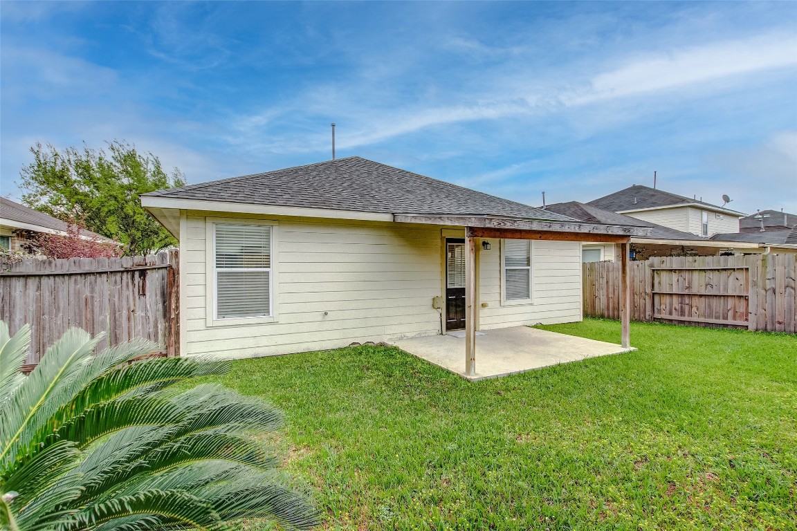 10822 Cane Grove Lane Houston, TX 77075 - Photo 43 of 44 a front view of a house with a yard and trees