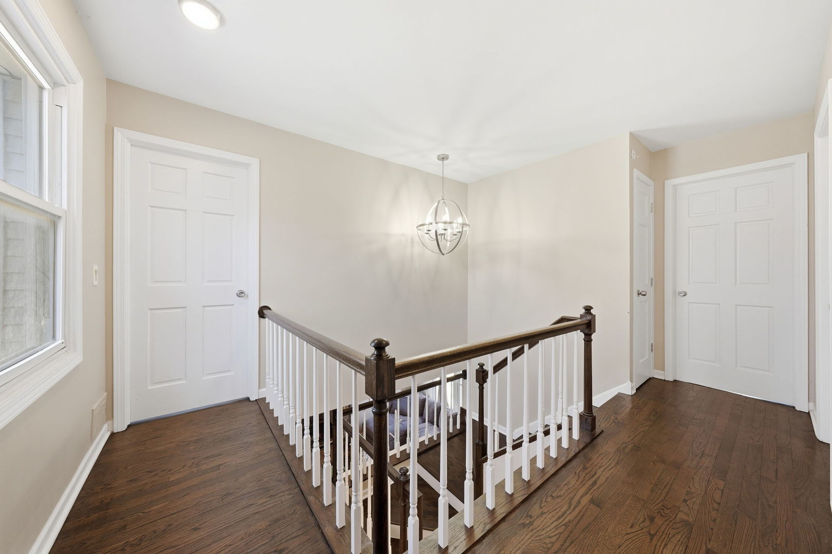 447 Thorndale Court Buffalo Grove, IL 60089 - Photo 13 of 24 a view of a hallway with wooden floor and staircase