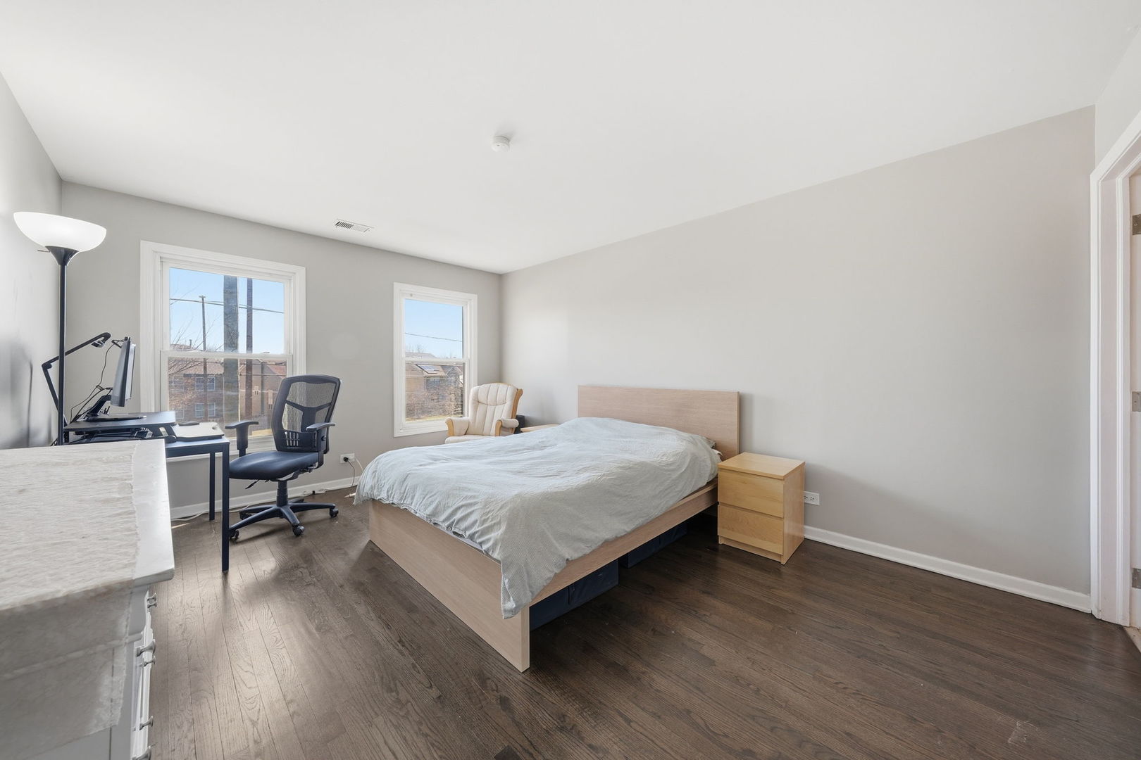 447 Thorndale Court Buffalo Grove, IL 60089 - Photo 14 of 24 a bedroom with a bed and wooden floor