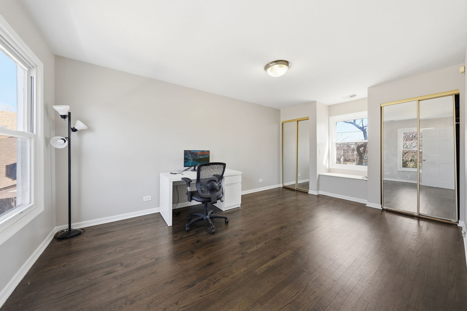447 Thorndale Court Buffalo Grove, IL 60089 - Photo 17 of 24 a view of a workspace with wooden floor and a window