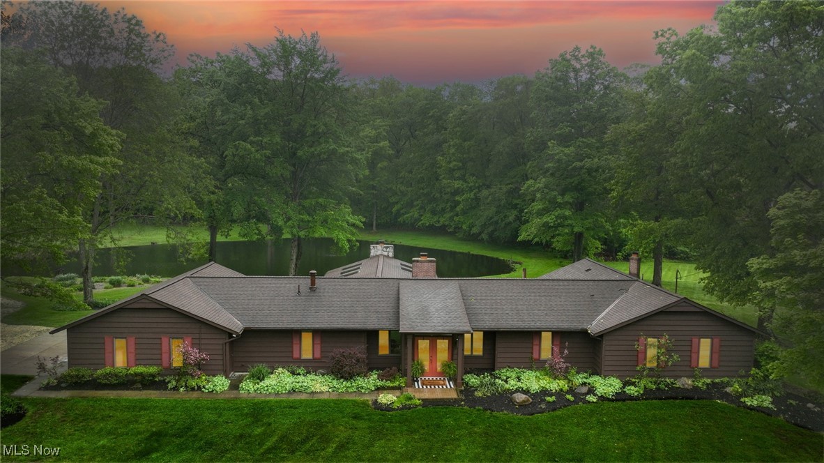 4010 State Road Medina, OH 44256 - Photo 2 of 50 View of front of house featuring a lawn, a chimney, a shingled roof, and french doors
