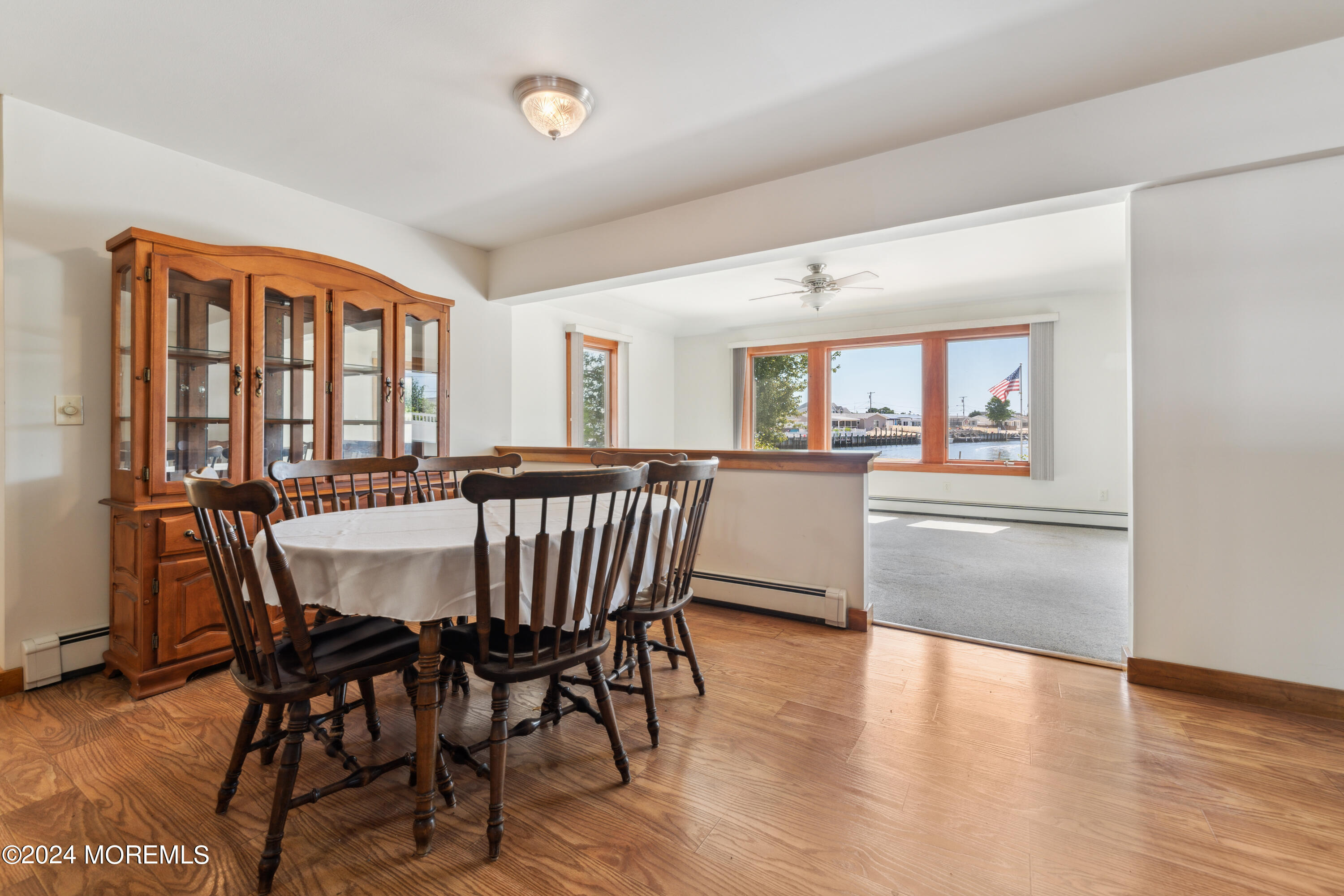 232 11th Street Barnegat, NJ 08005 - Photo 11 of 39 a dining room with furniture and wooden floor