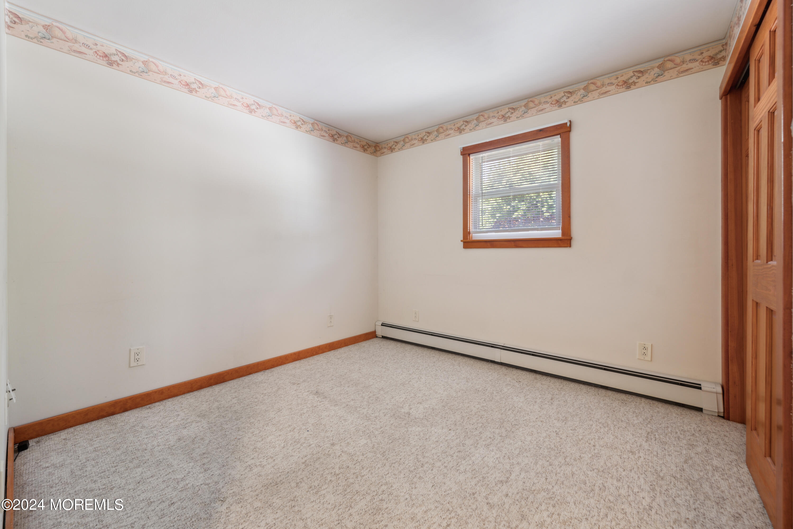 232 11th Street Barnegat, NJ 08005 - Photo 15 of 39 a view of an empty room with a window