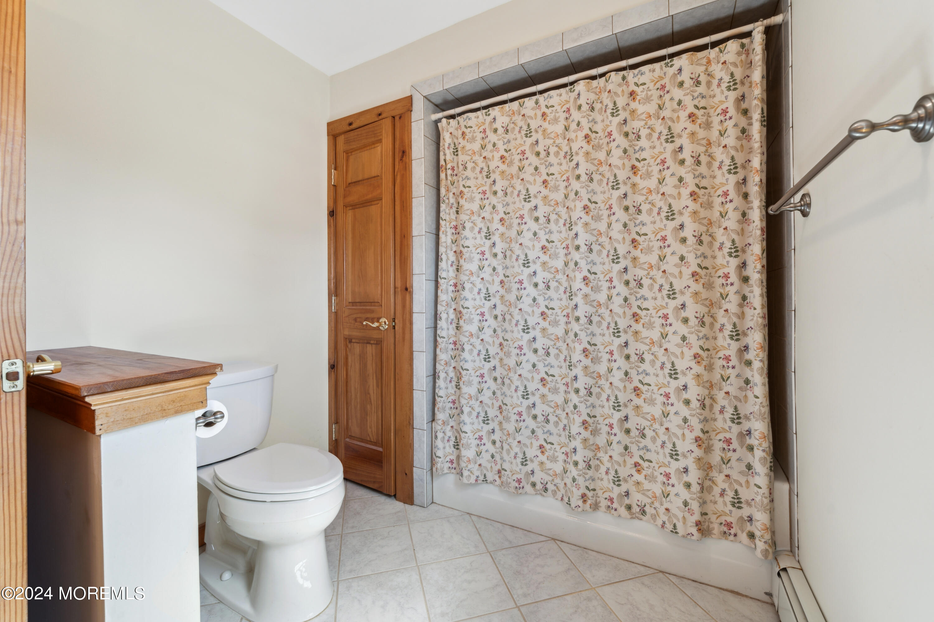 232 11th Street Barnegat, NJ 08005 - Photo 20 of 39 a bathroom with a toilet and shower