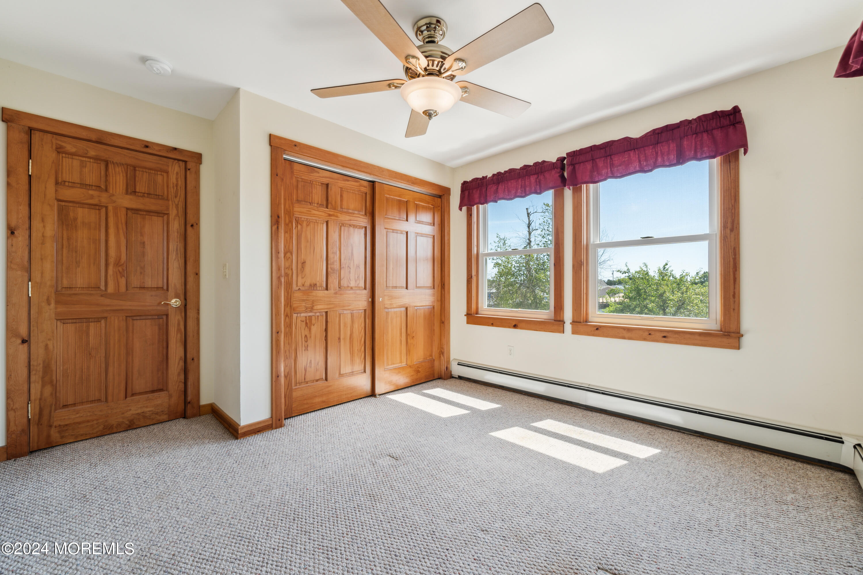 232 11th Street Barnegat, NJ 08005 - Photo 21 of 39 an empty room with windows and fan