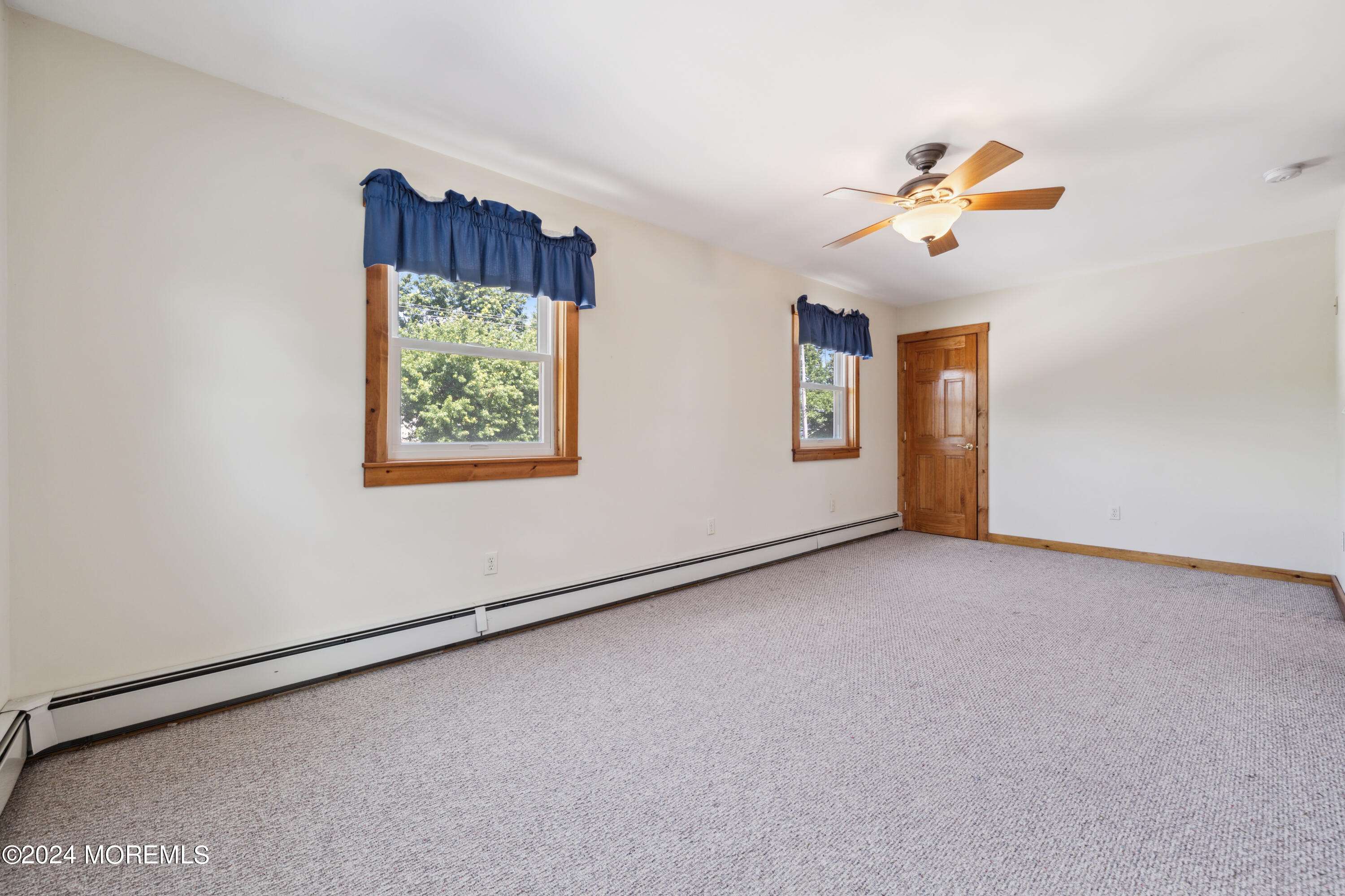 232 11th Street Barnegat, NJ 08005 - Photo 23 of 39 a view of an empty room with a window