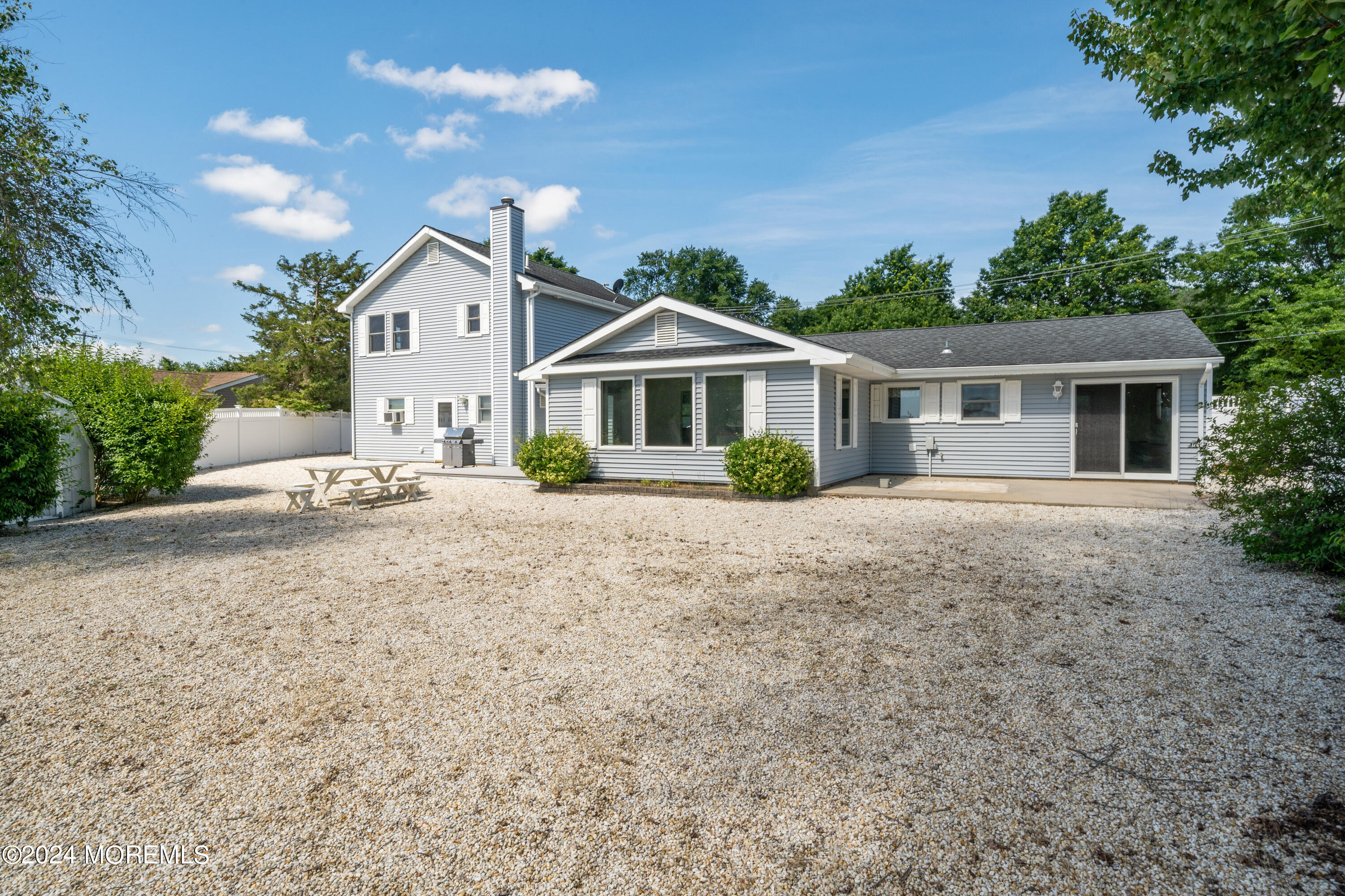 232 11th Street Barnegat, NJ 08005 - Photo 24 of 39 a front view of a house with a yard