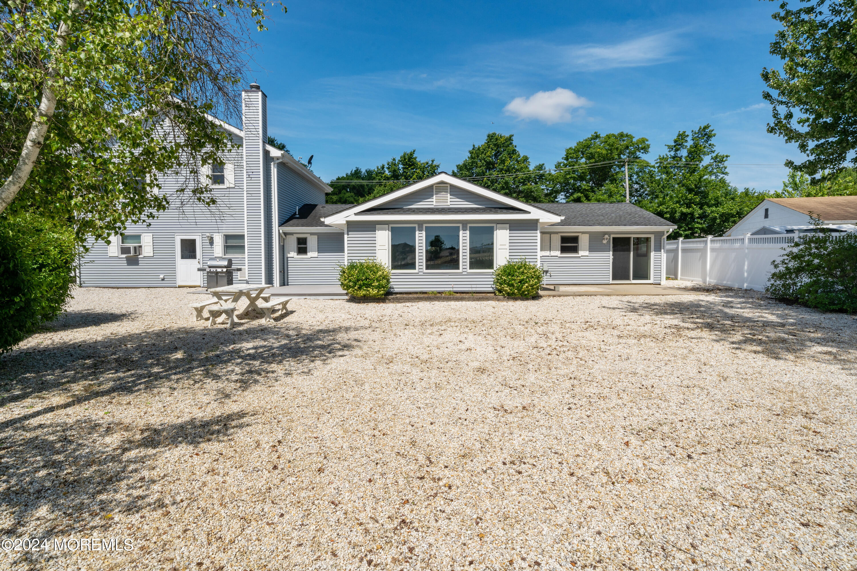 232 11th Street Barnegat, NJ 08005 - Photo 26 of 39 a front view of a house with a yard and trees