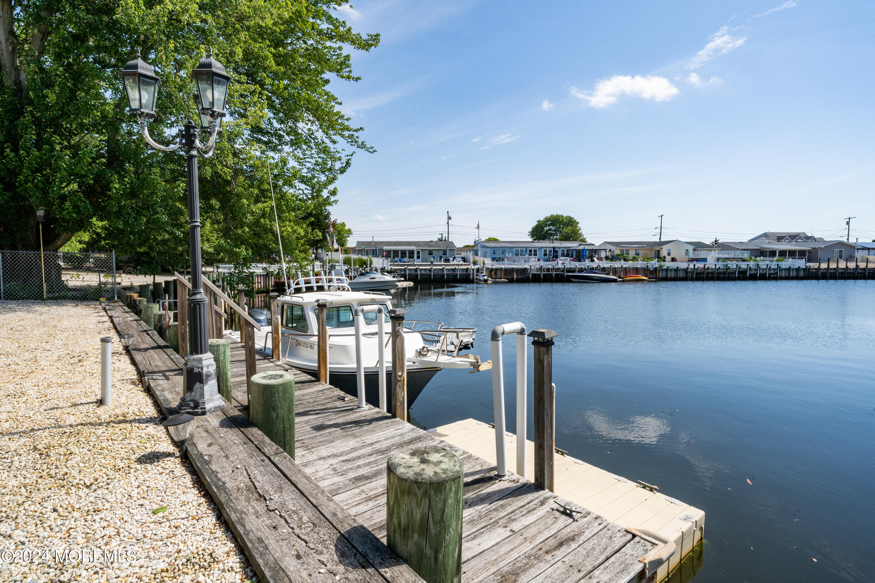 232 11th Street Barnegat, NJ 08005 - Photo 28 of 39 a view of a lake with chairs