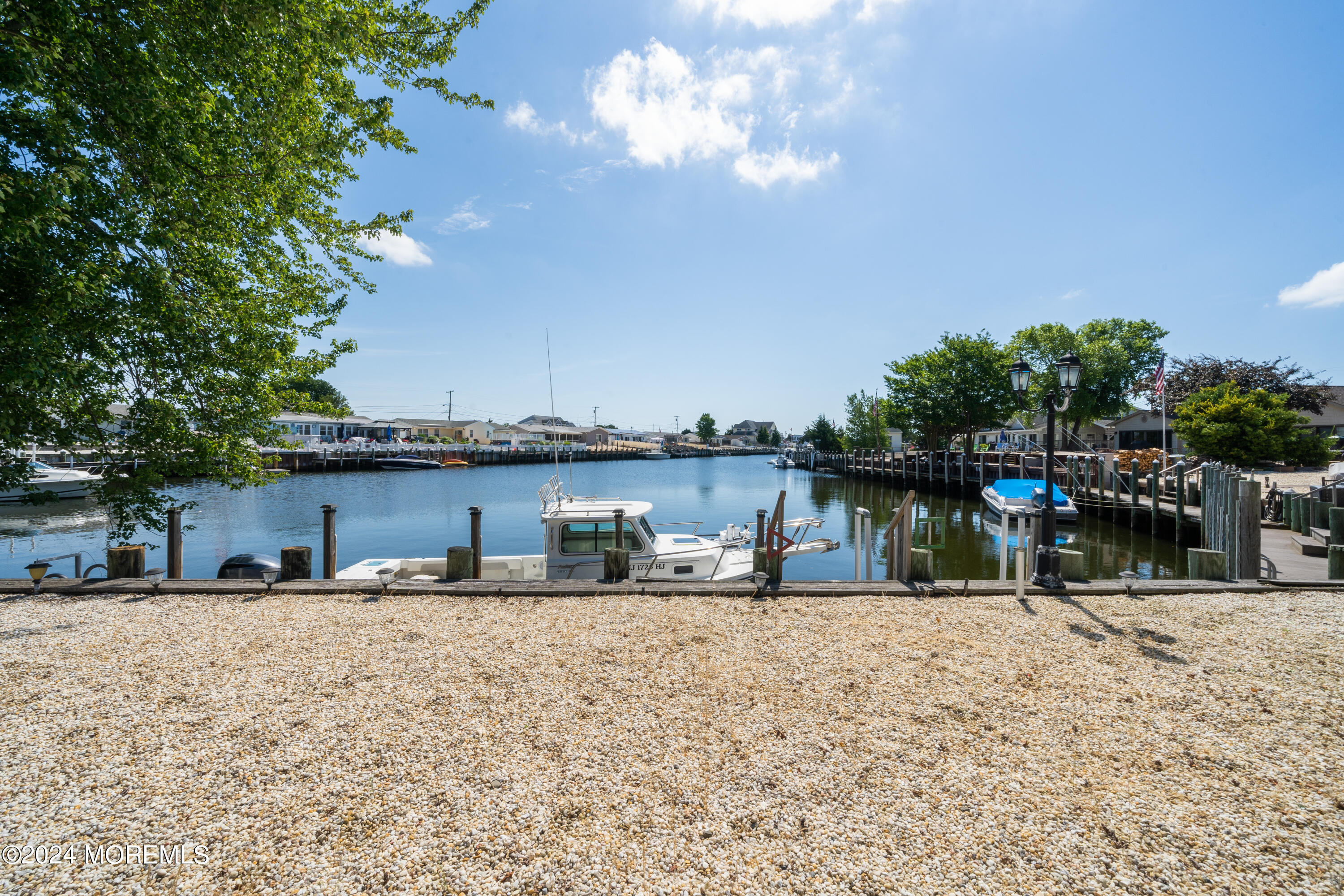 232 11th Street Barnegat, NJ 08005 - Photo 29 of 39 a swimming pool with outdoor seating and yard