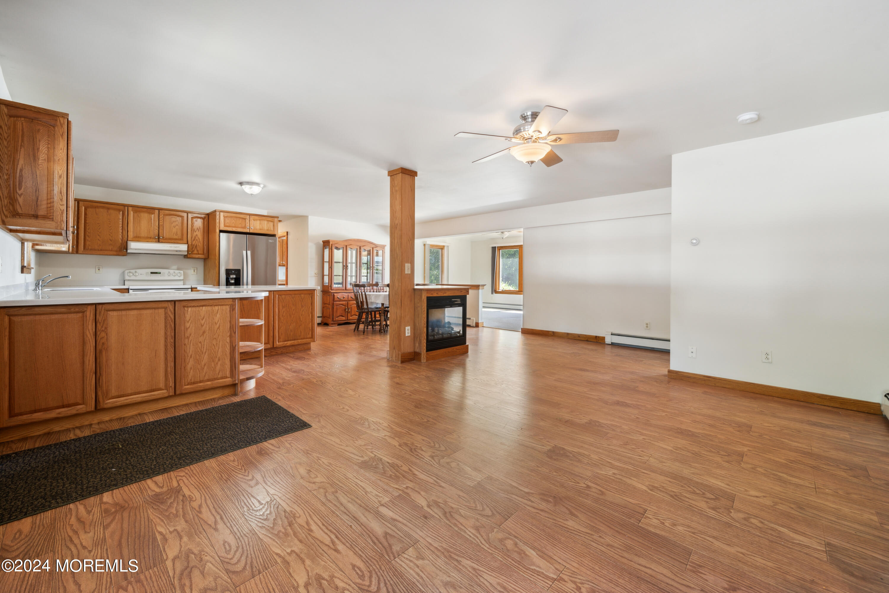 232 11th Street Barnegat, NJ 08005 - Photo 7 of 39 a living room with furniture and a chandelier