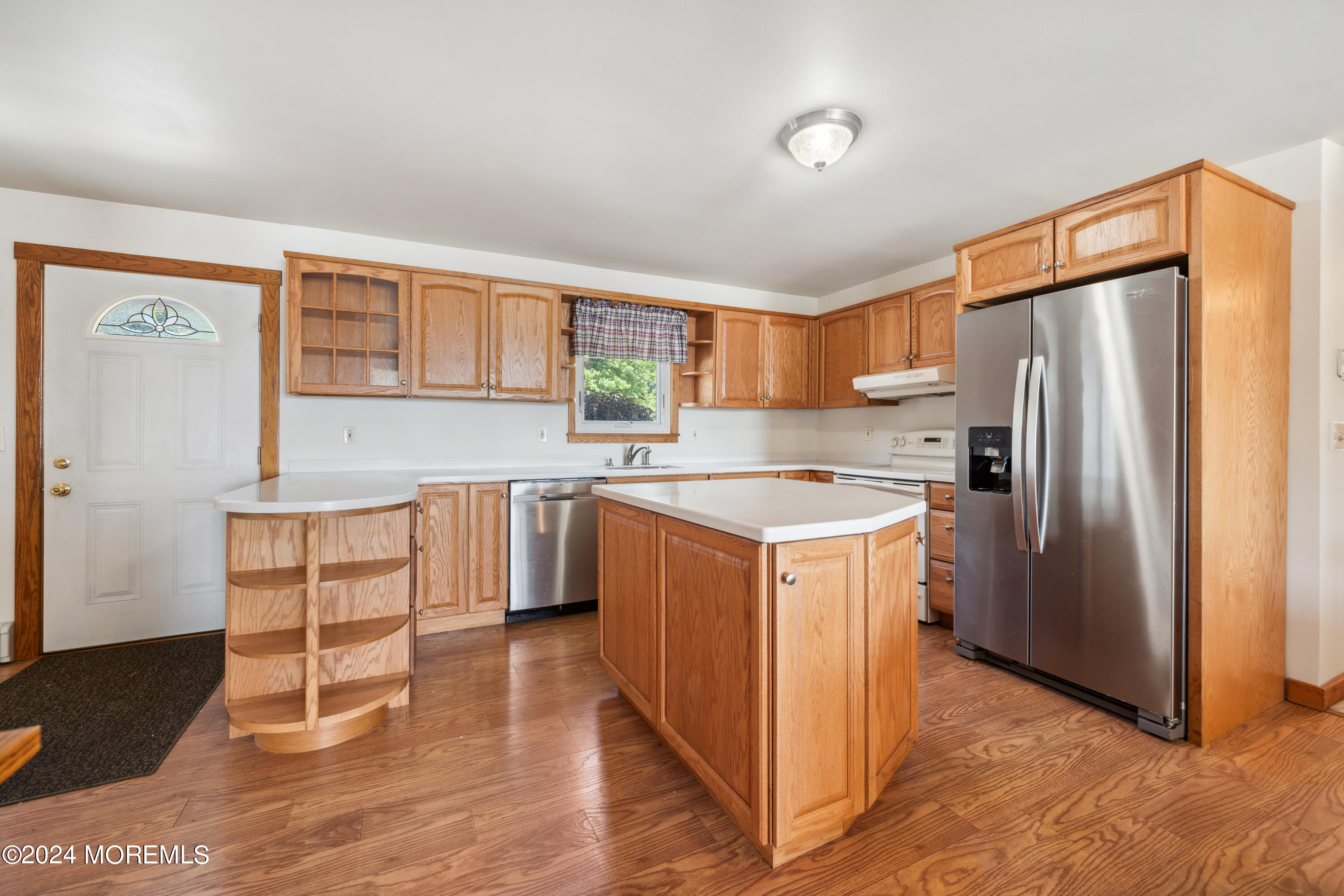 232 11th Street Barnegat, NJ 08005 - Photo 8 of 39 a kitchen with a refrigerator sink and cabinets