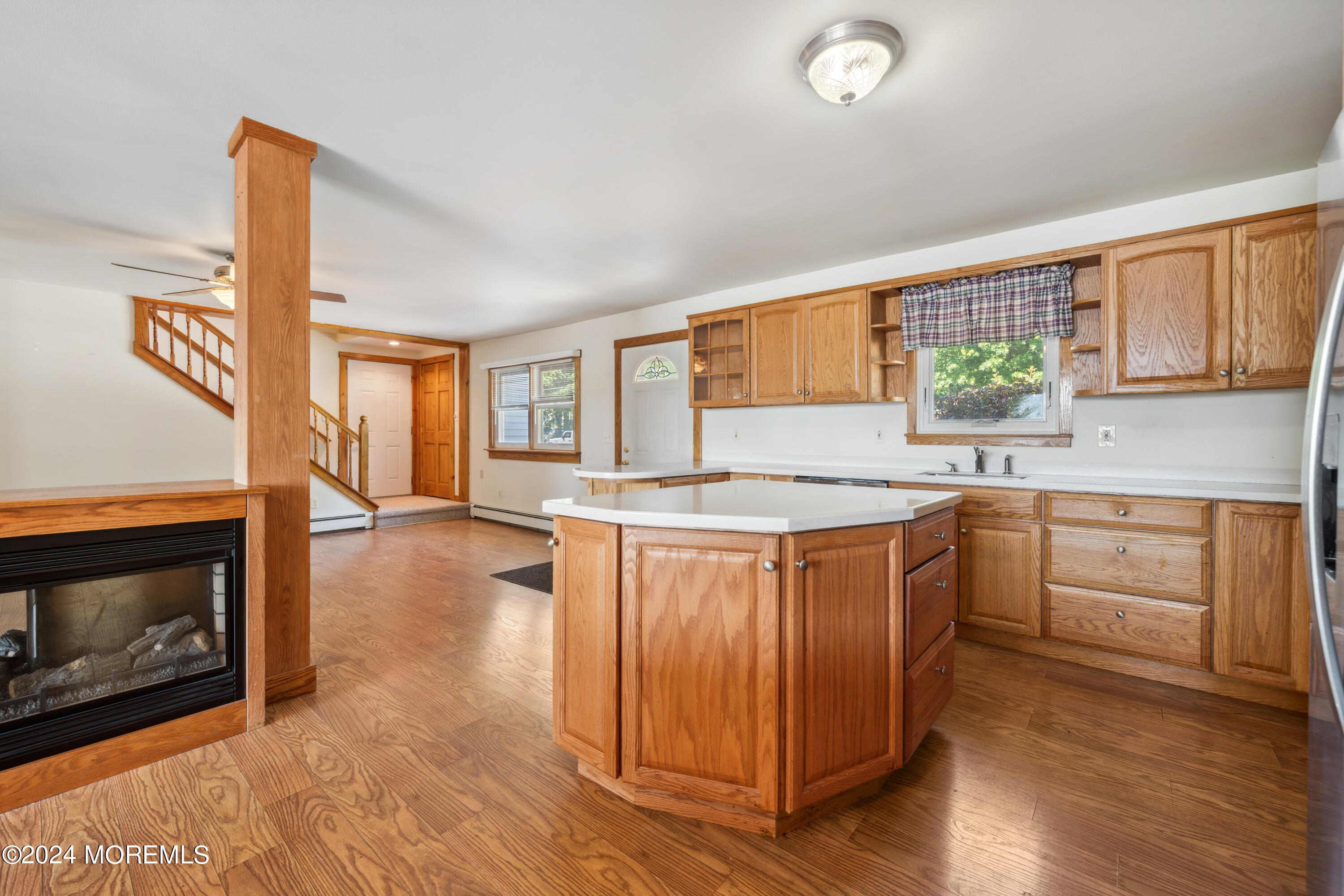 232 11th Street Barnegat, NJ 08005 - Photo 9 of 39 a kitchen with stainless steel appliances granite countertop a stove a sink and a microwave