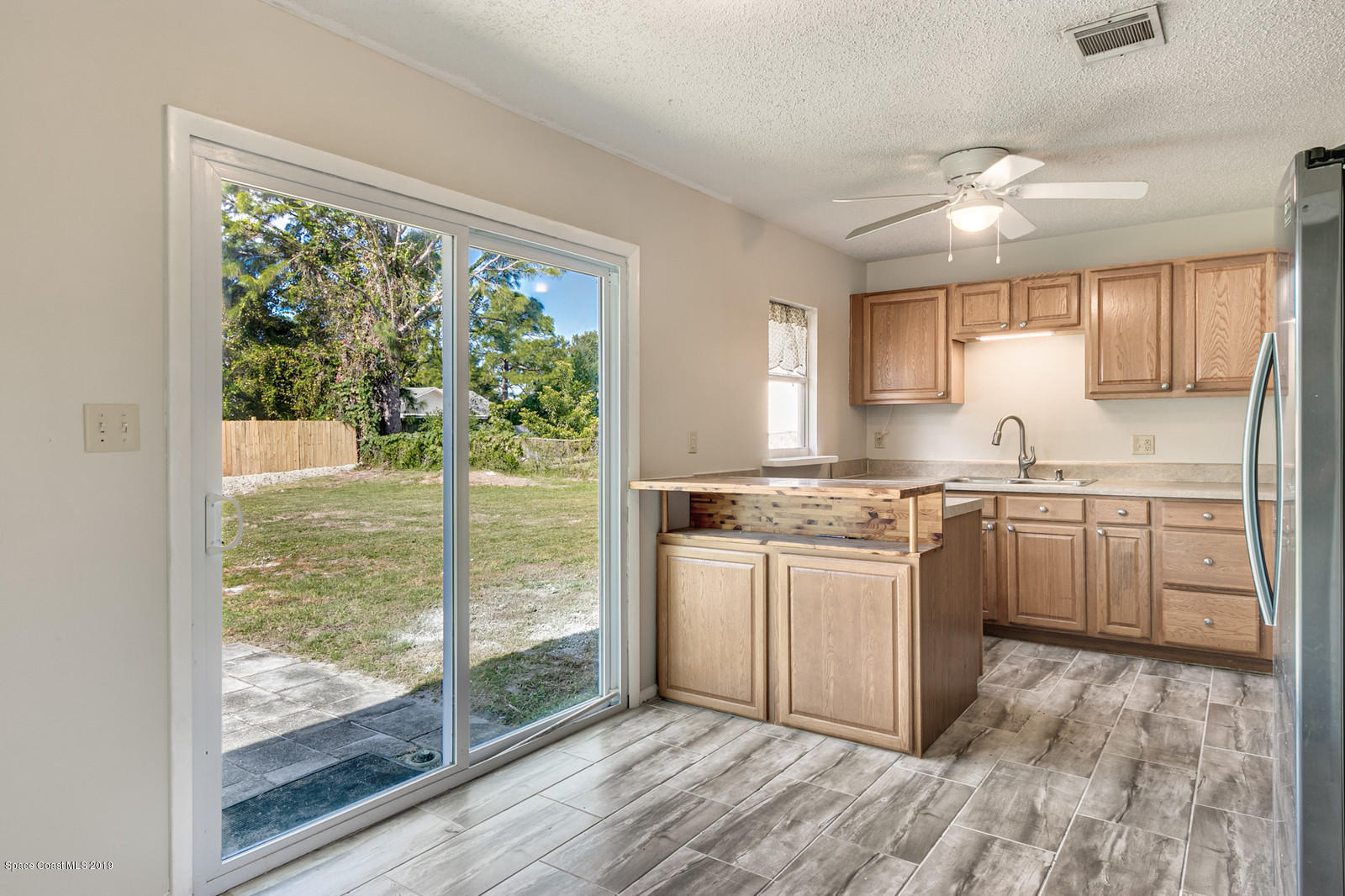 5964 Rena Avenue Cocoa, FL 32927 - Photo 4 of 16 Dining Room with Kitchen View