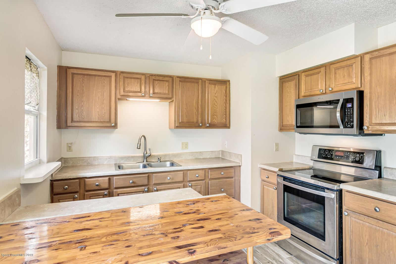 5964 Rena Avenue Cocoa, FL 32927 - Photo 5 of 16 Kitchen with Breakfast Bar