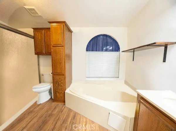 a bathroom with a shower curtain and a toilet