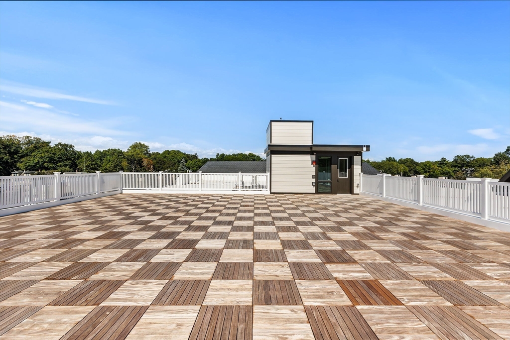 1114 Beacon Street, Unit 206 Newton, MA 02461 - Photo 34 of 39 a view of a terrace with a bench
