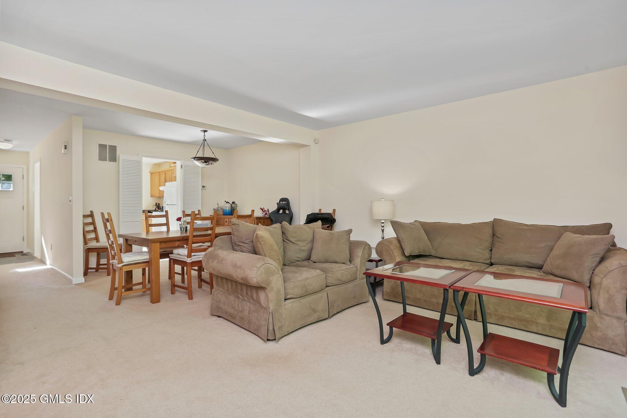74 Silo Circle Riverside, CT 06878 - Photo 11 of 29 a living room with furniture and a large window