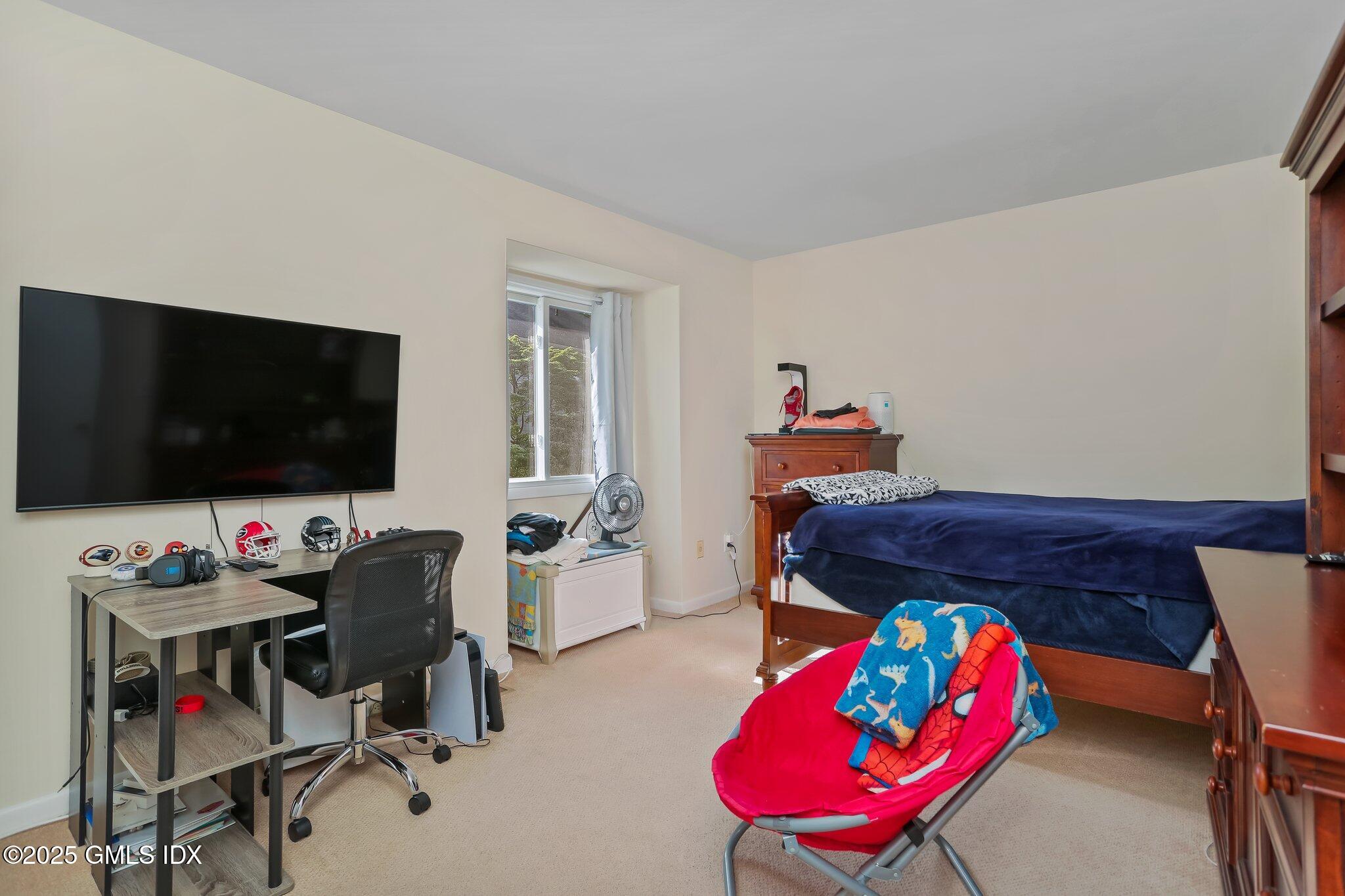 74 Silo Circle Riverside, CT 06878 - Photo 17 of 29 a living room with furniture and a flat screen tv