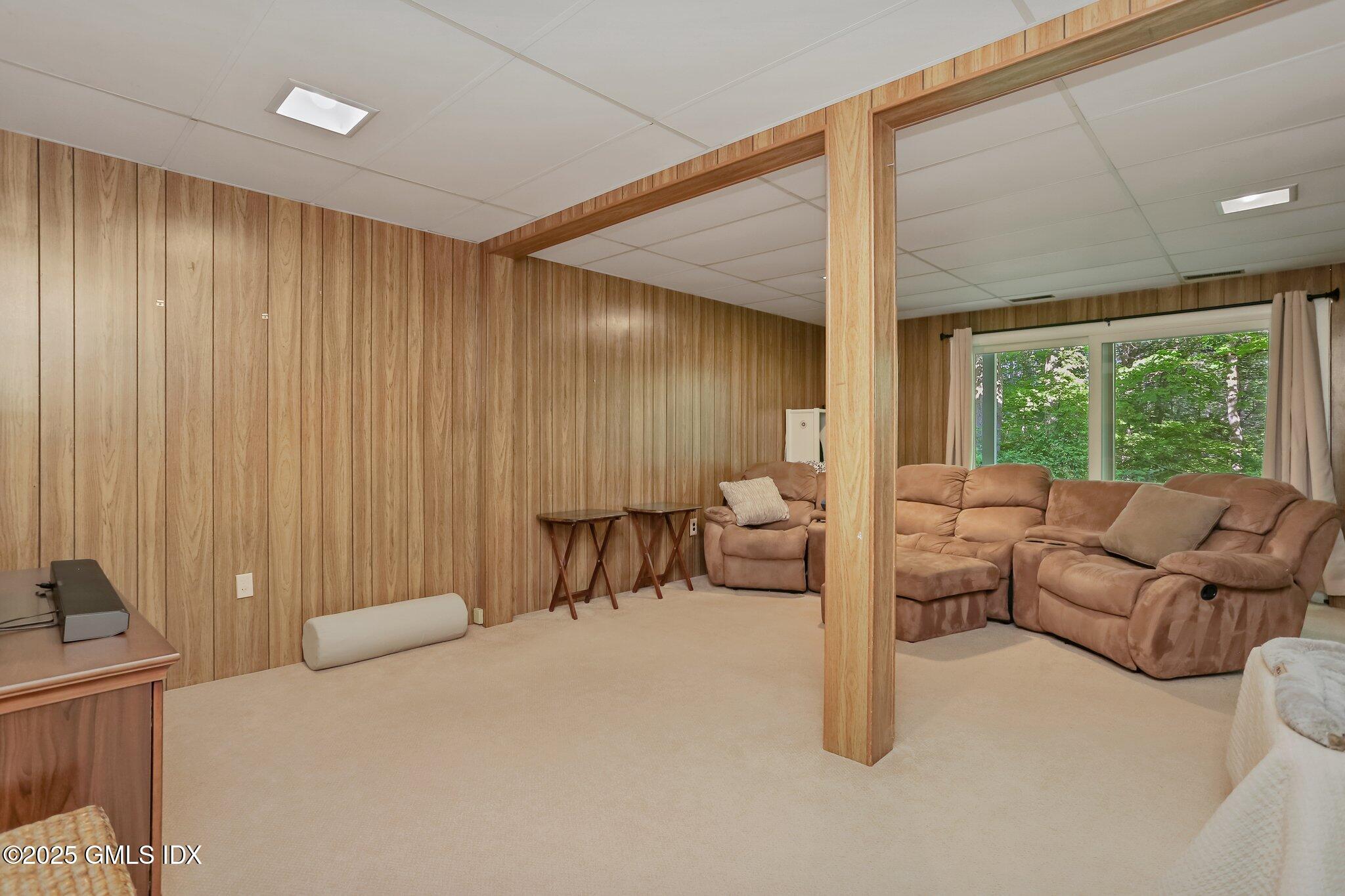 74 Silo Circle Riverside, CT 06878 - Photo 20 of 29 a bedroom with furniture and a large window