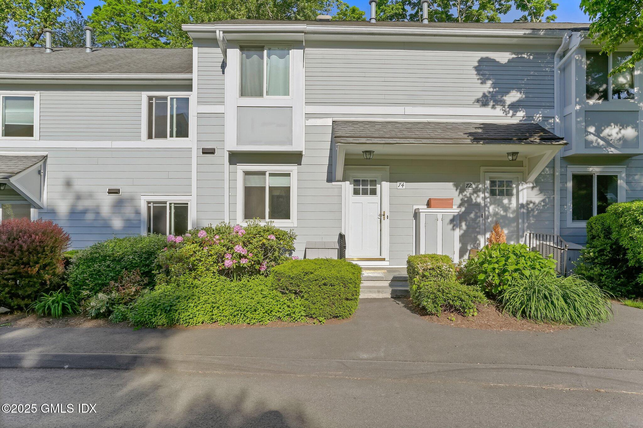 74 Silo Circle Riverside, CT 06878 - Photo 2 of 29 front view of house and a yard