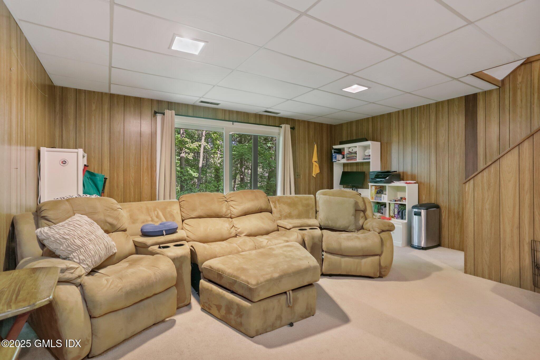 74 Silo Circle Riverside, CT 06878 - Photo 21 of 29 a living room with furniture and a large window