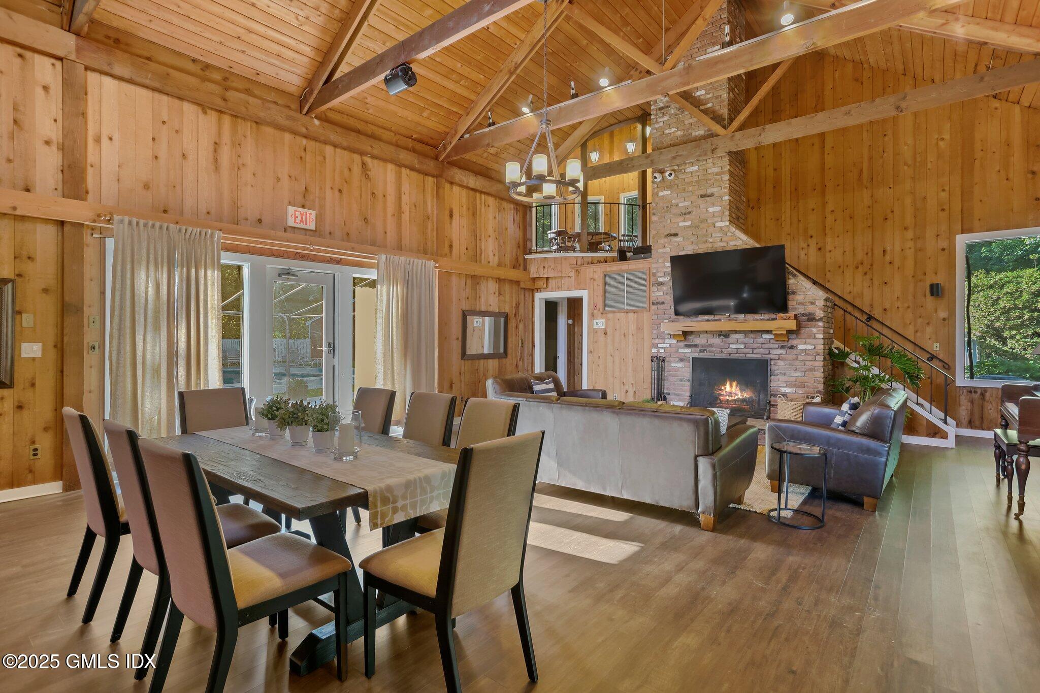 74 Silo Circle Riverside, CT 06878 - Photo 24 of 29 a view of a dining room with furniture wooden floor and a fireplace