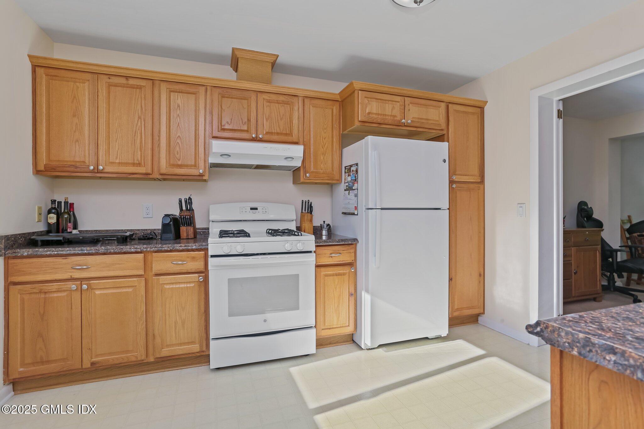 74 Silo Circle Riverside, CT 06878 - Photo 6 of 29 a kitchen with stainless steel appliances granite countertop a refrigerator sink and stove