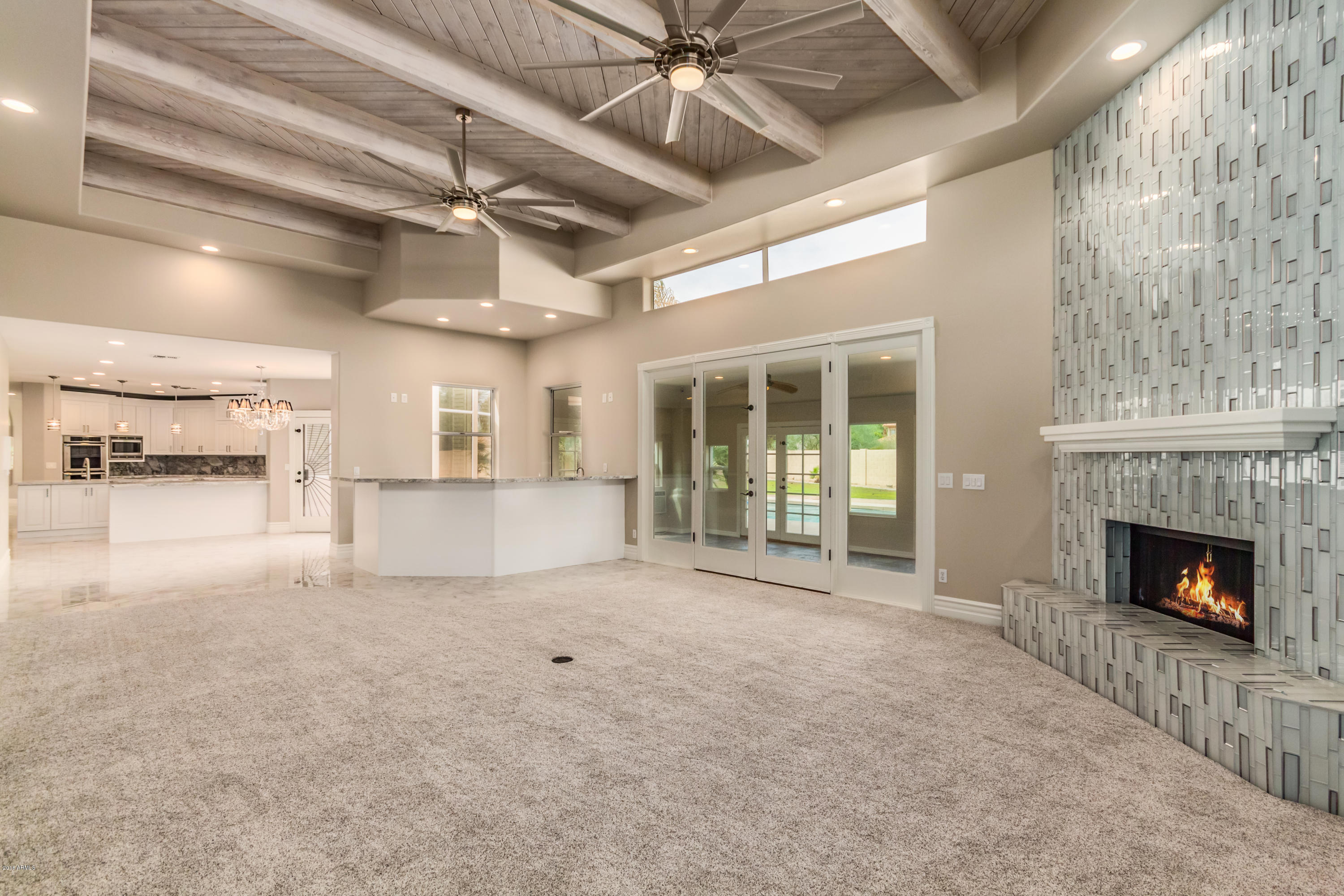 3332 East Cherokee Street Phoenix, AZ 85044 - Photo 16 of 47 a view of empty room with a fireplace and fan