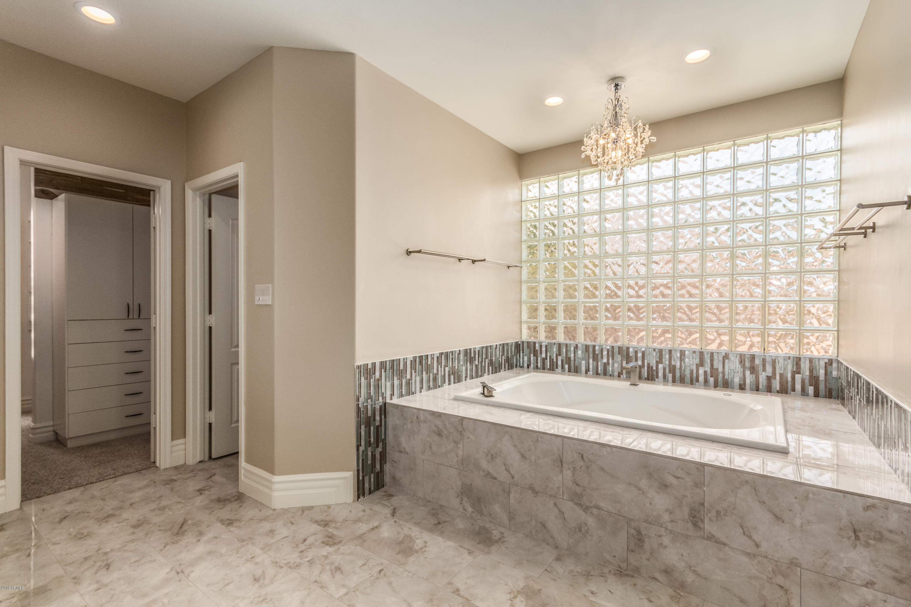 3332 East Cherokee Street Phoenix, AZ 85044 - Photo 22 of 47 a bathroom with a bathtub and a shower