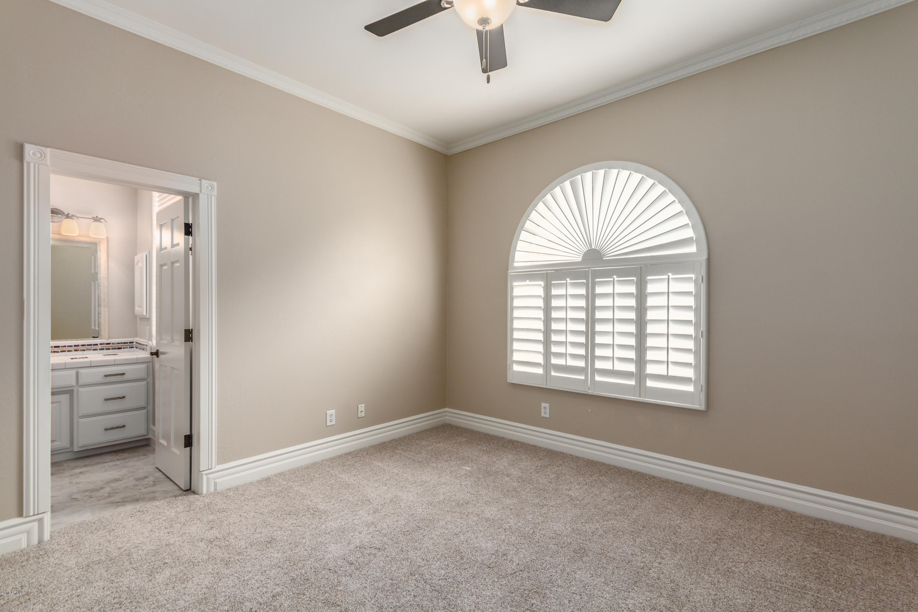 3332 East Cherokee Street Phoenix, AZ 85044 - Photo 30 of 47 an empty room with windows and closet