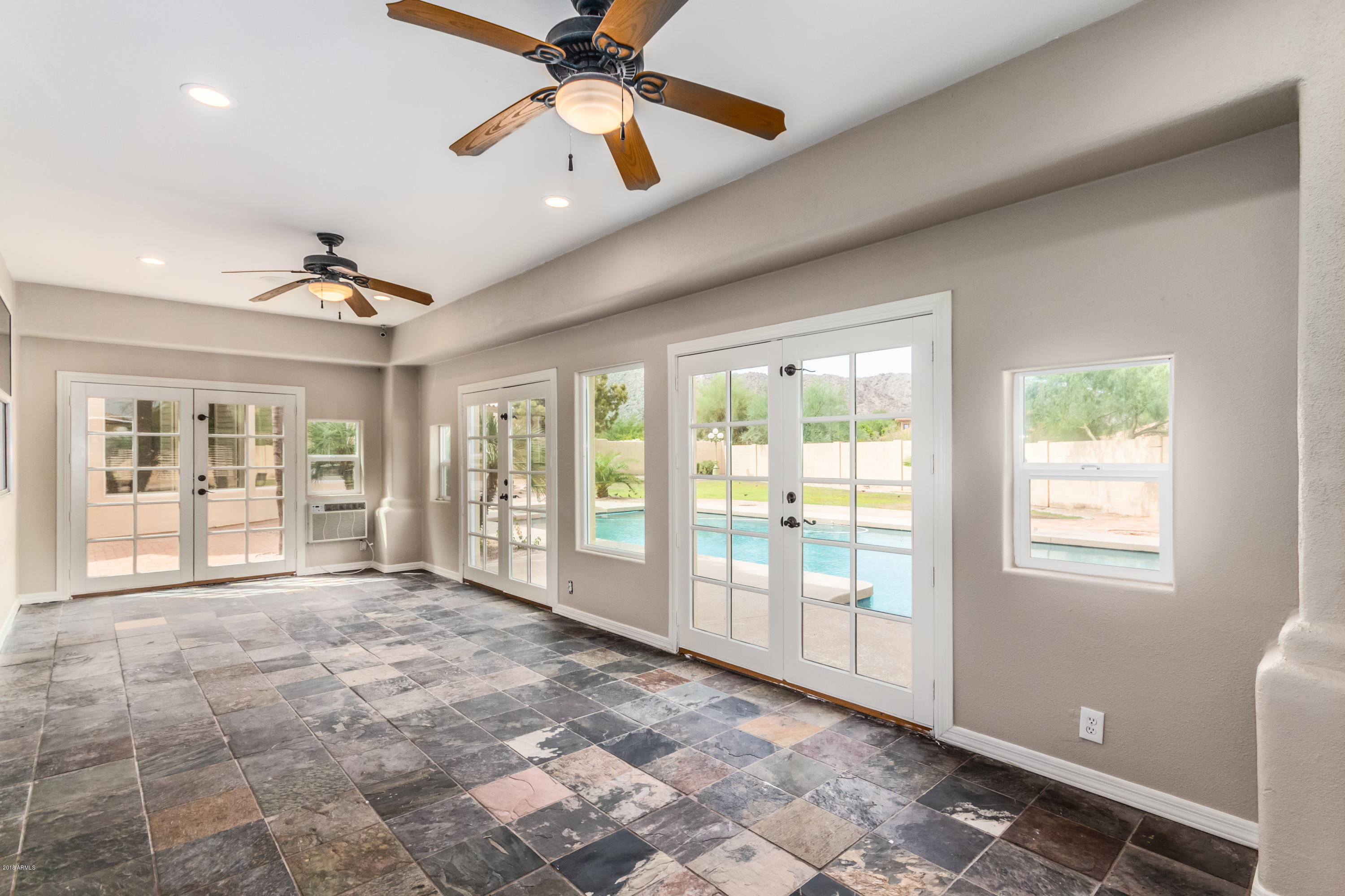 3332 East Cherokee Street Phoenix, AZ 85044 - Photo 32 of 47 a view of an empty room with a window