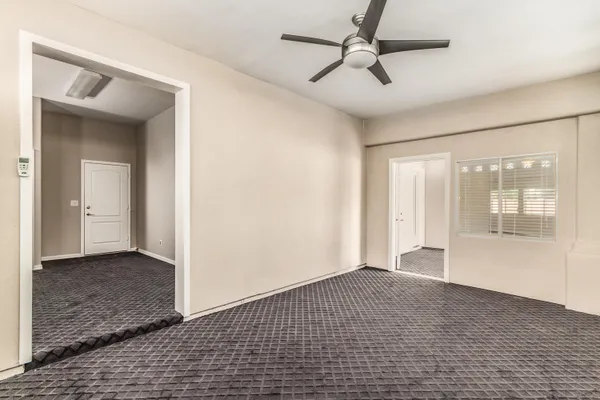 a view of an empty room with a window