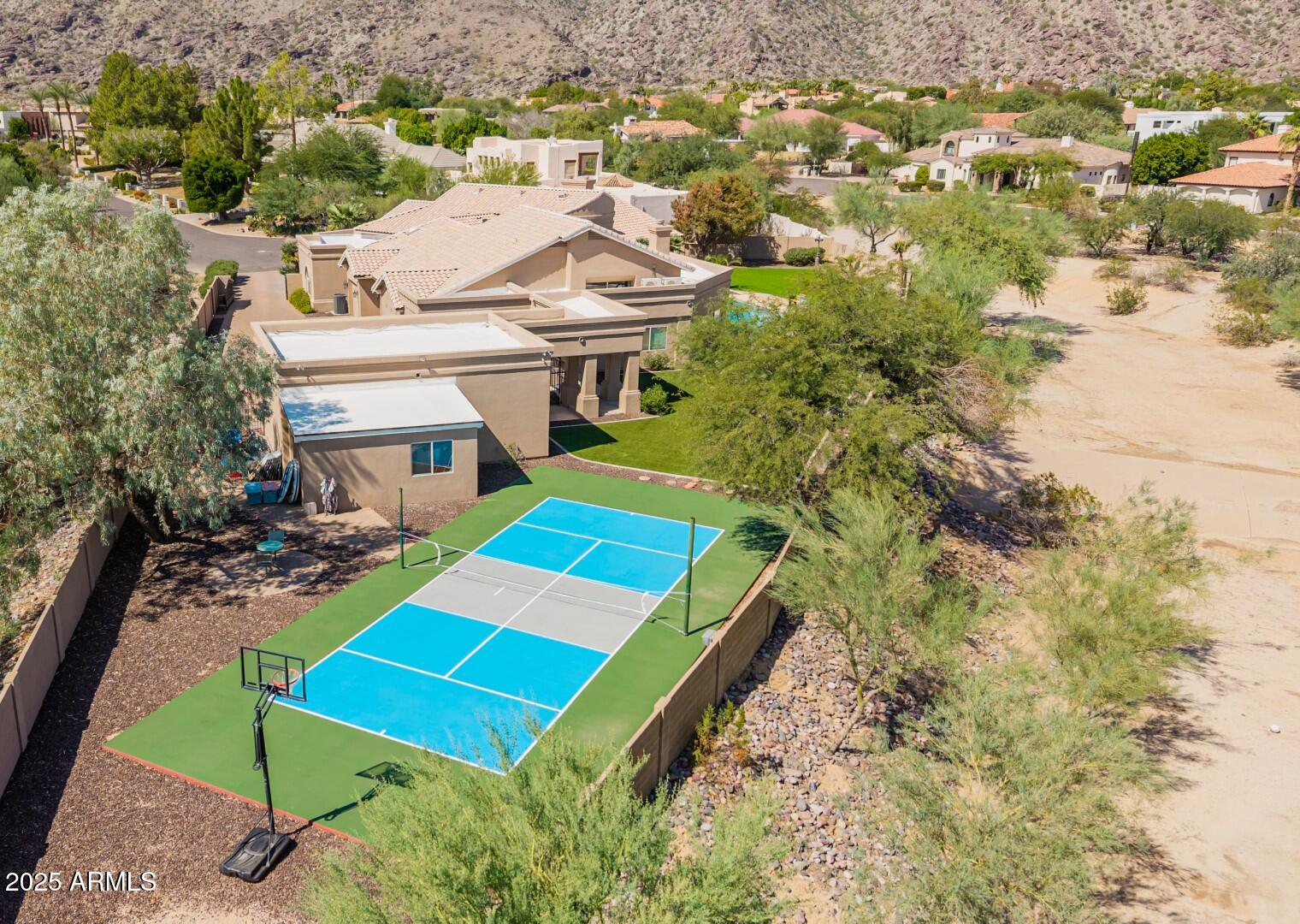 3332 East Cherokee Street Phoenix, AZ 85044 - Photo 44 of 47 an aerial view of a tennis ground with large trees