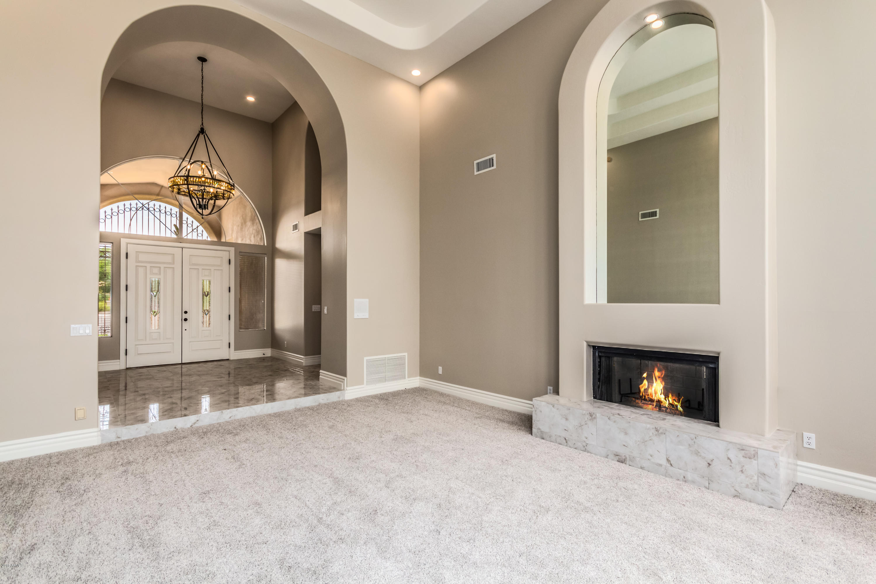 3332 East Cherokee Street Phoenix, AZ 85044 - Photo 6 of 47 a view of a fireplace in a room