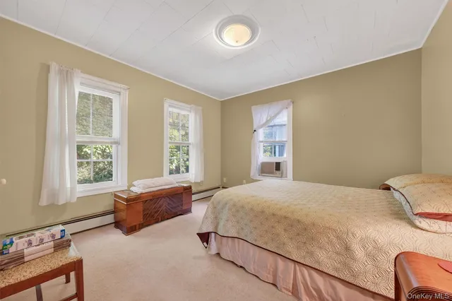 a bedroom with a bed and window
