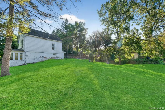 a view of a backyard with a small cabin