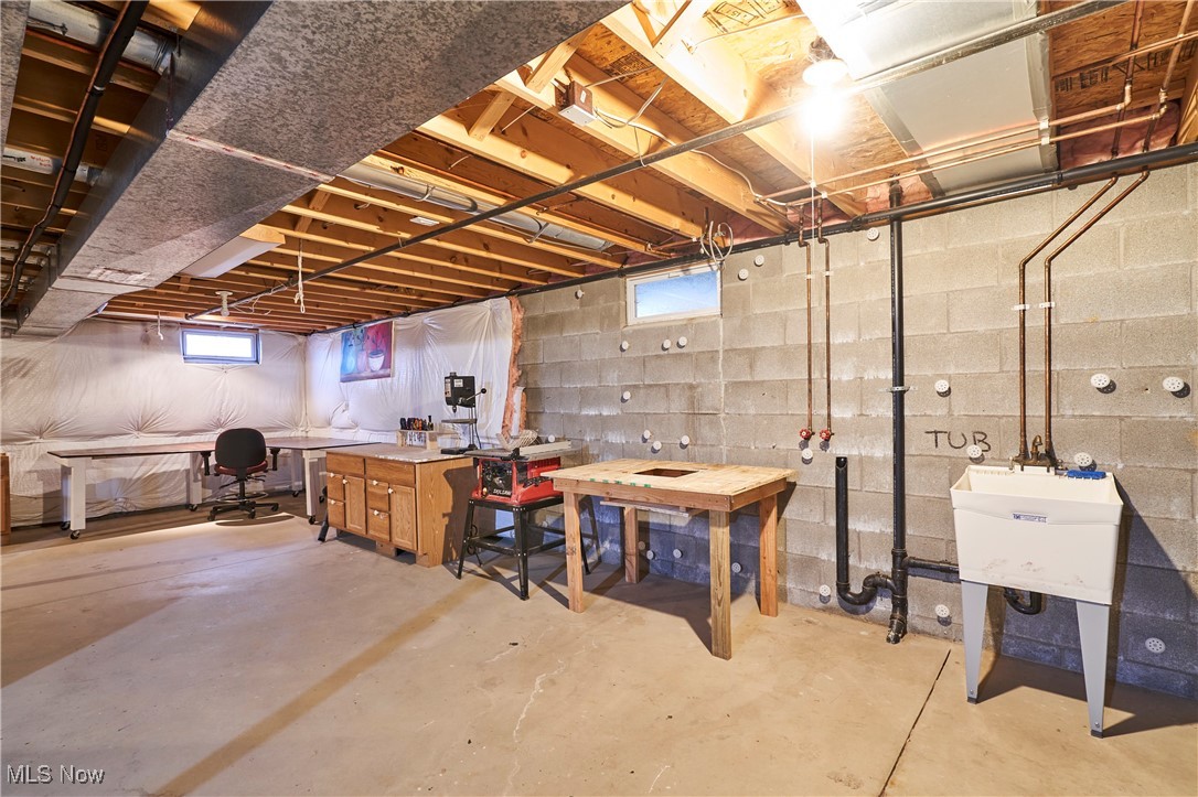 637 Redfield Lane Akron, OH 44321 - Photo 25 of 31 Basement with a workshop area and sink