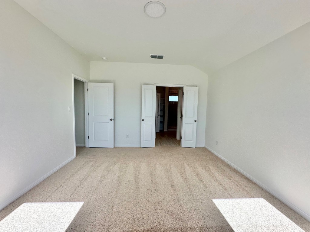 372 Glocken Lane Kyle, TX 78640 - Photo 14 of 37 a view of an empty room with wooden floor