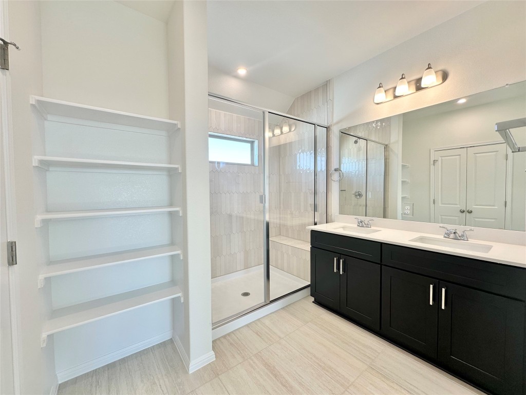 372 Glocken Lane Kyle, TX 78640 - Photo 16 of 37 a bathroom with a double vanity sink mirror and double