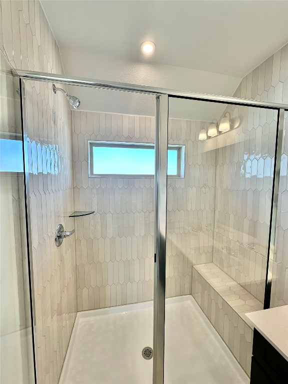 372 Glocken Lane Kyle, TX 78640 - Photo 17 of 37 a bathroom with a glass door shower and a sink