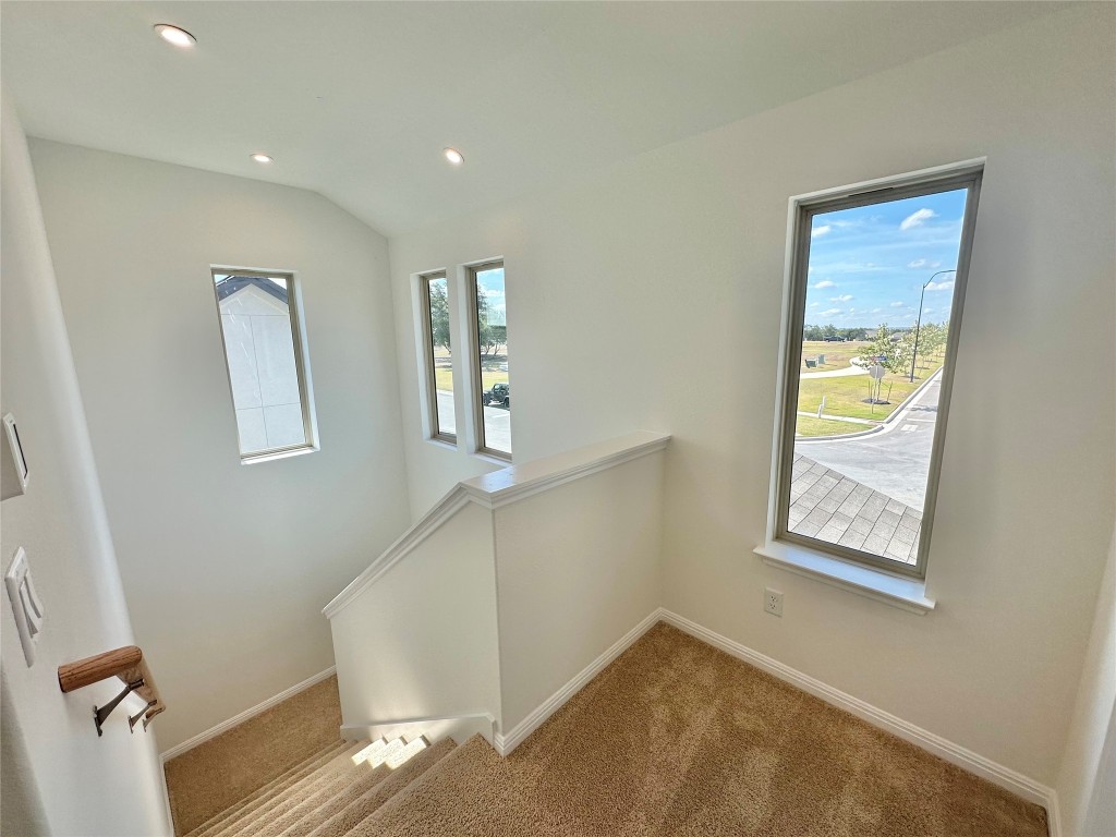 372 Glocken Lane Kyle, TX 78640 - Photo 18 of 37 a view of hallway with window and wooden floor